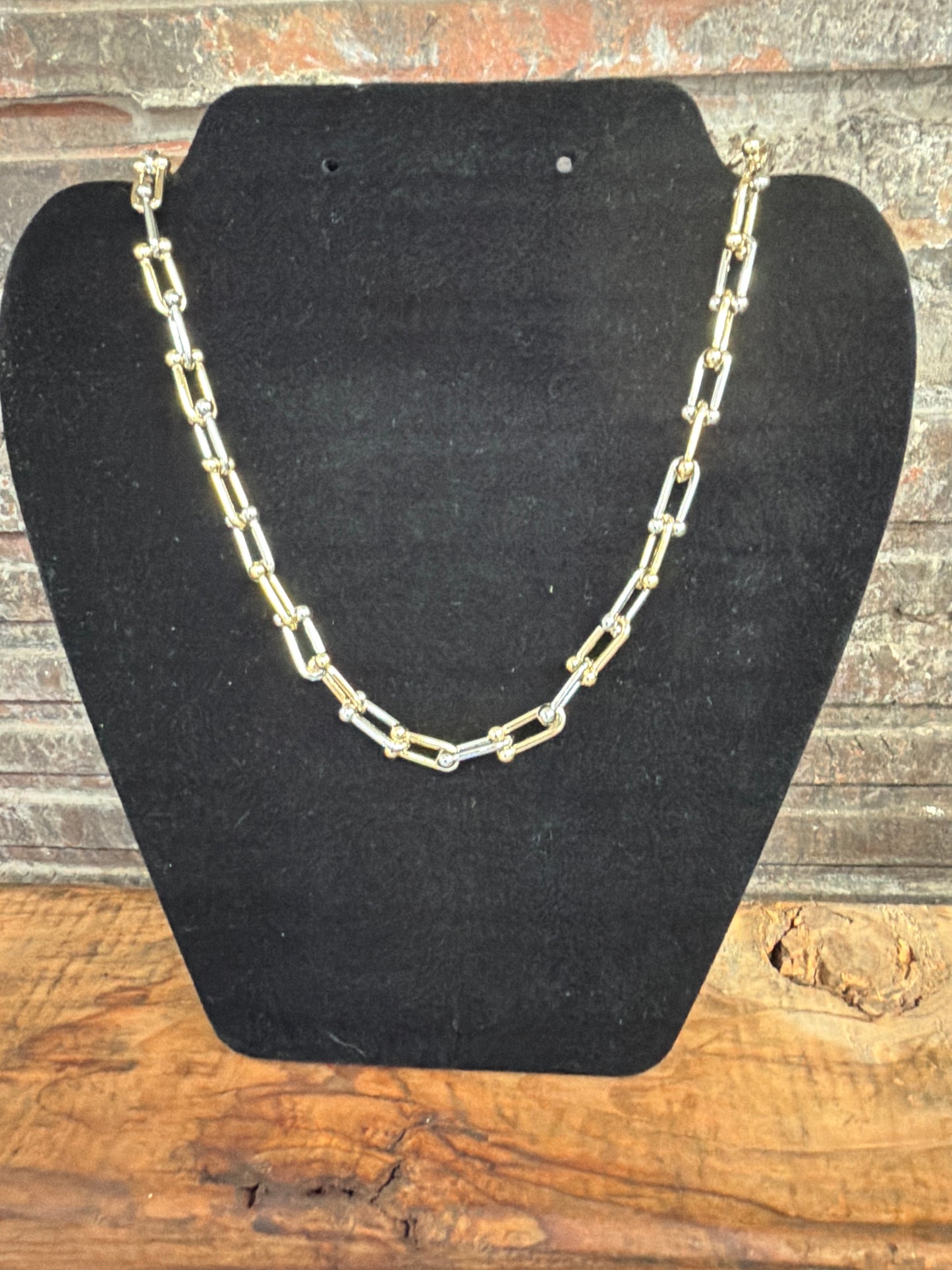 necklace alternating gold and silver chain links