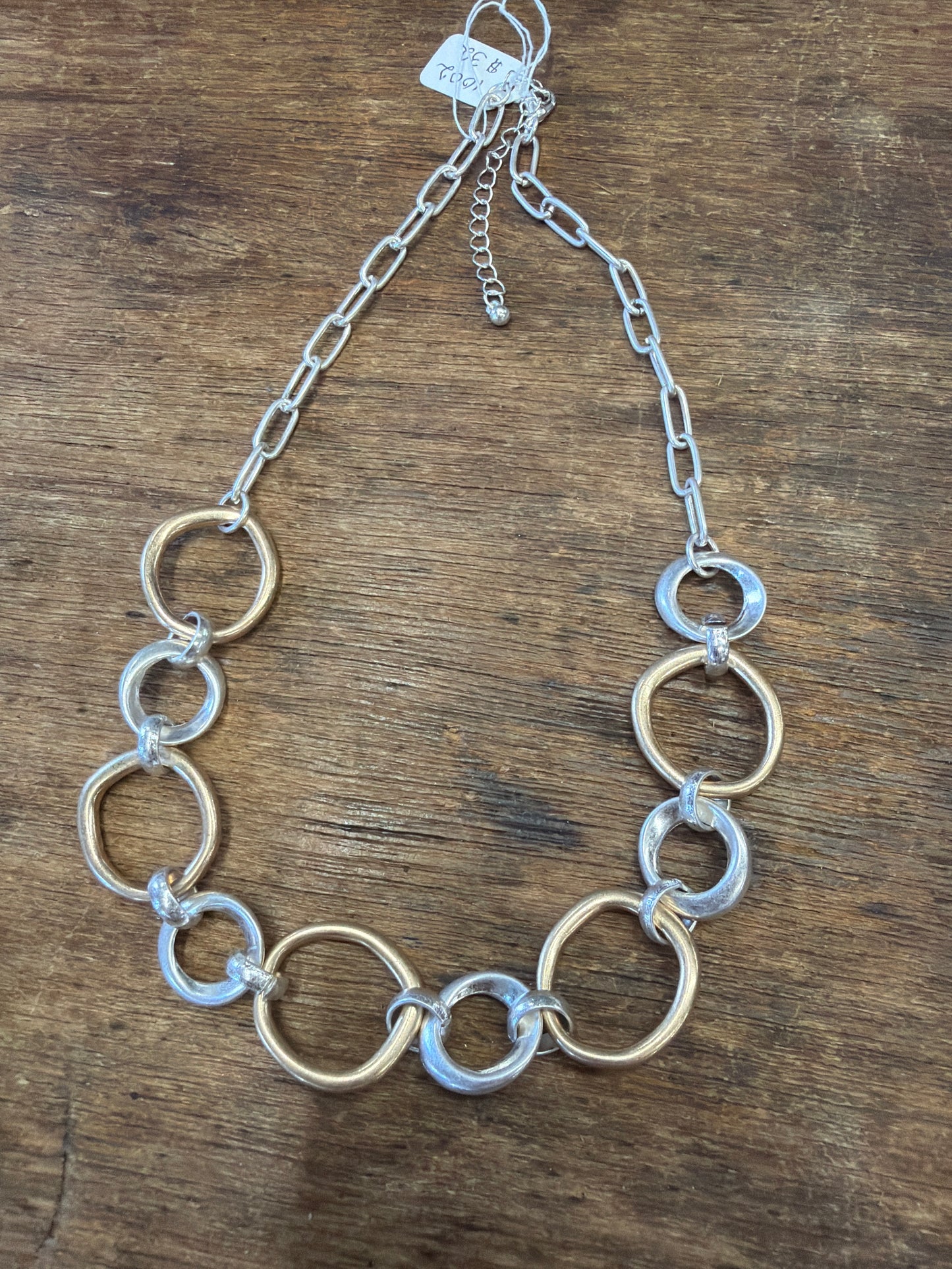 necklace alternating gold and silver circles irregular shapes